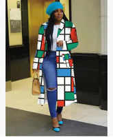 Woman wearing a colorful Lapel Windbreaker Jacket for Stylish Outerwear, paired with blue accessories and ripped jeans.