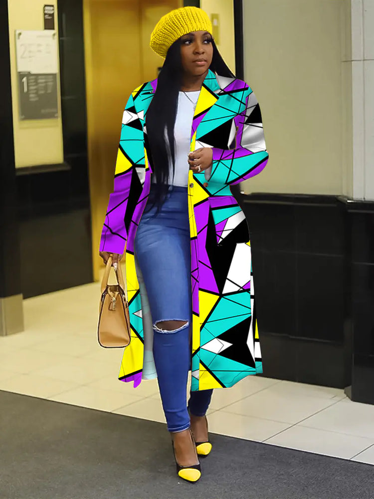 Model wearing a Lapel Windbreaker Jacket for Stylish Outerwear, featuring a colorful geometric design, paired with jeans and a yellow beanie.